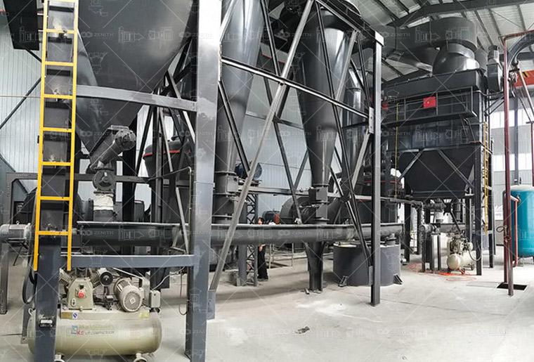 Technician in lab coat analyzing fine white calcium carbonate powder under a particle size analyzer.